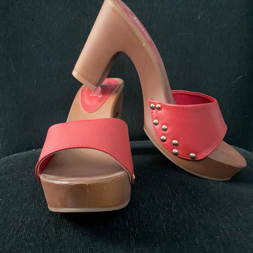 Red and brown heels with brass studs identical to Sandy’s in the movie Grease.